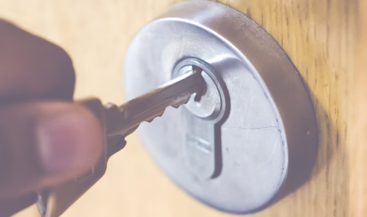someone using front door key after replacing external door locks